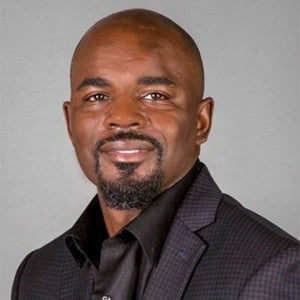 Headshot of a man smiling at the camera
