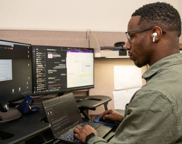 HSUS employee working at his desk