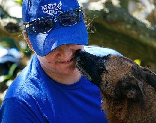 HSUS staff holding a dog during Hurricane Ian disaster response