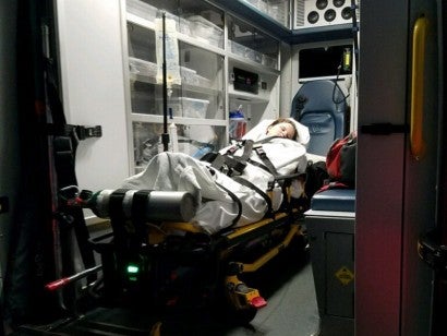 Petland employee and victim of drug-resistant Campylobacter infection on her way to the hospital.