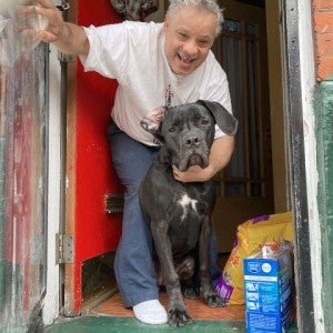 Man gets pet food from Pets for Life, run by the HSUS