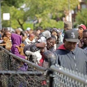Line of people and their pets at Pets for Life event