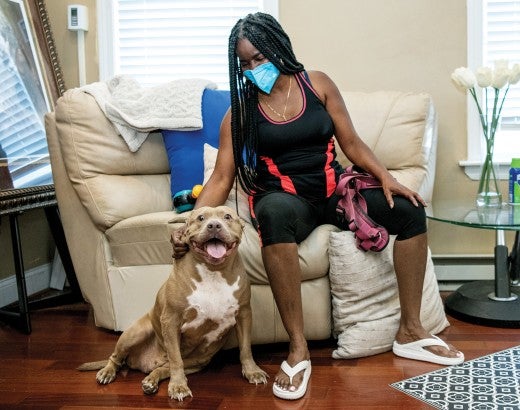 Portrait of Denise Young with her dog Drama.