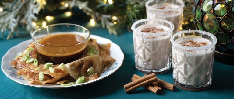 A beautiful holiday spread of mushroom potsticker dumplings and coconut nog.