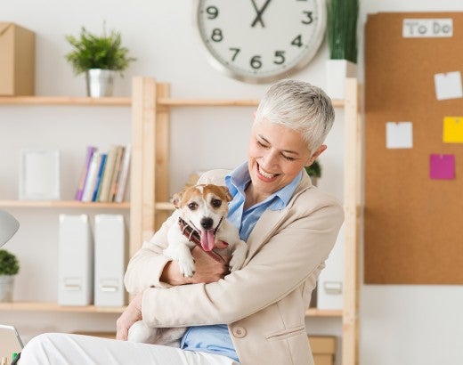 Woman and her dog in the workplace